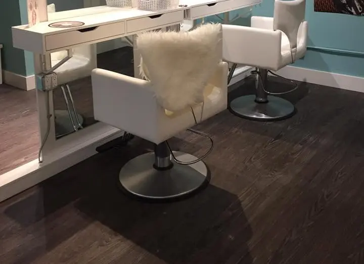Clean customer-facing salon space with styling chairs