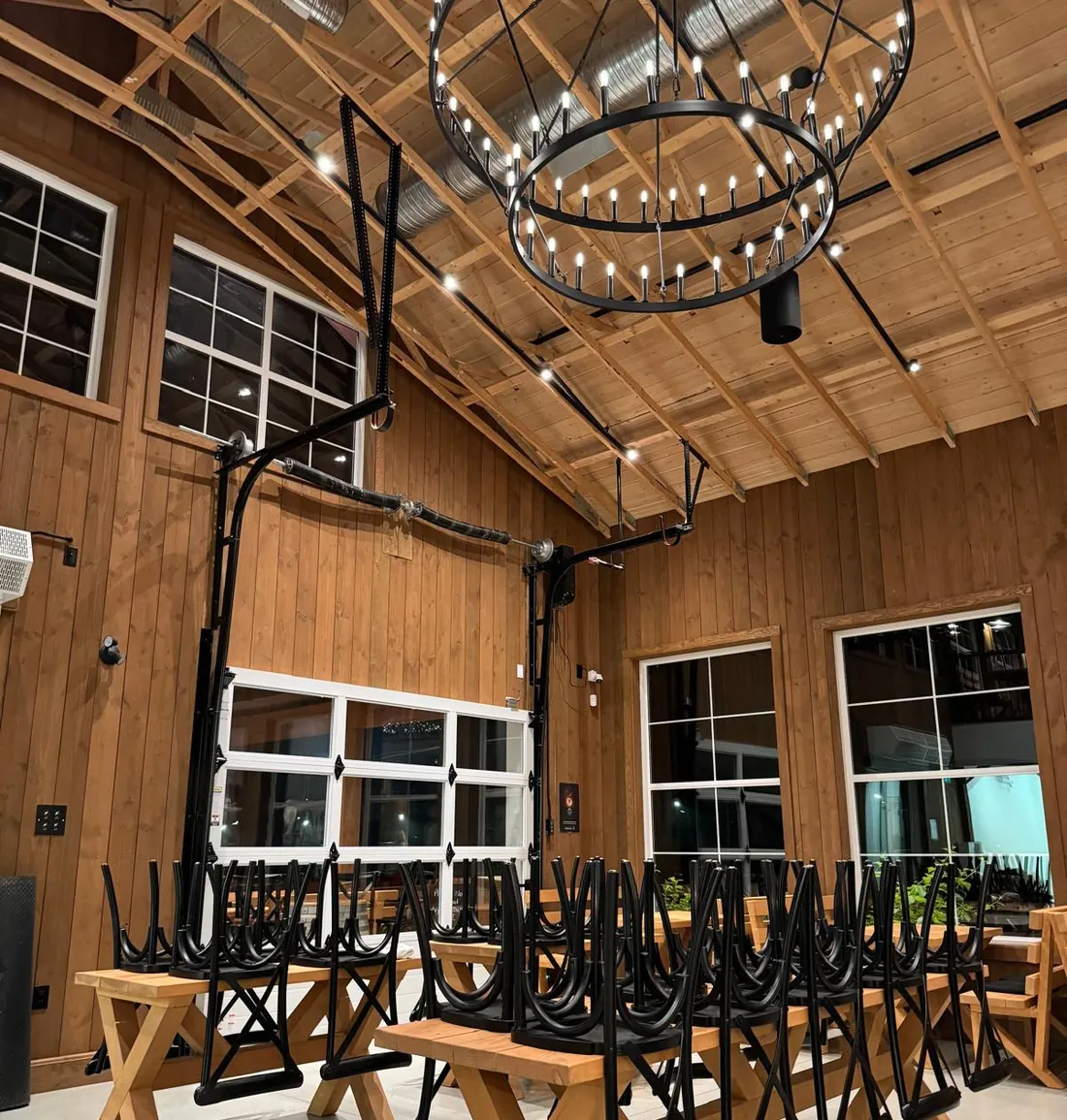 Clean commercial event space with tables and chairs