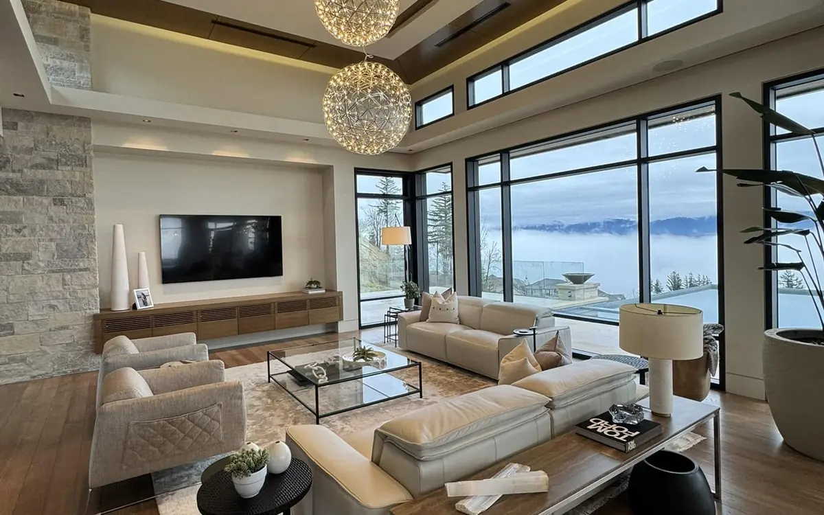 Clean modern living room with polished floors and large windows