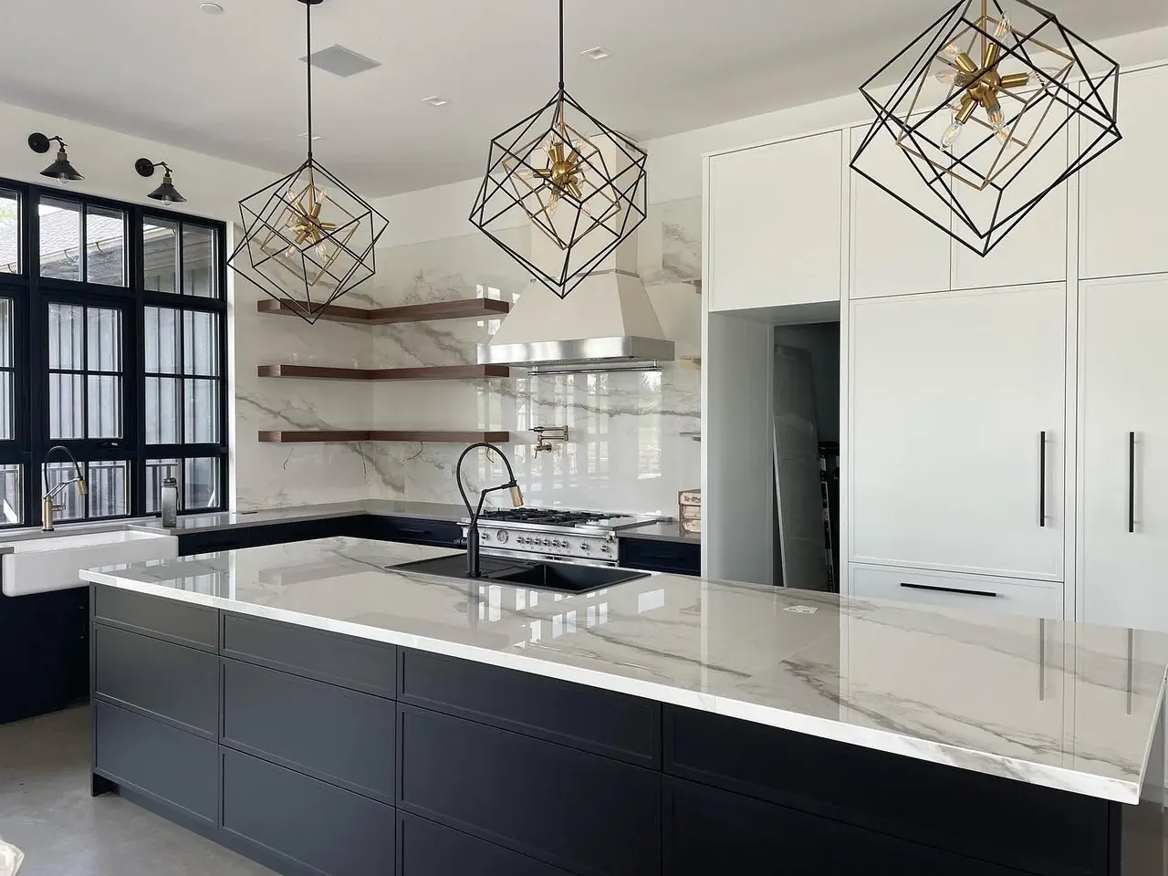 Clean, empty kitchen with a marble island, ready for move-in