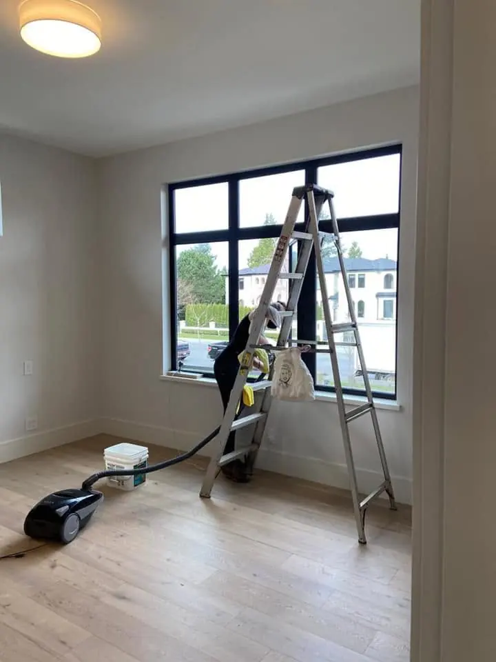 Vacuum and ladder in a room during detailed cleanup