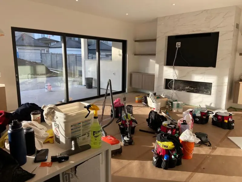 Cleaning equipment set out in a living space during post-construction cleaning