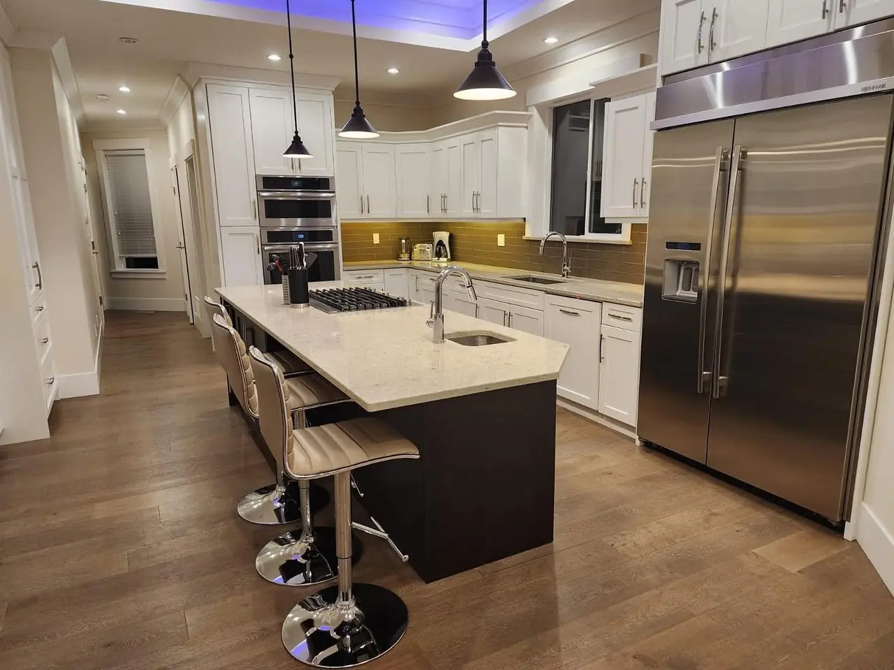 Clean, presentation-ready kitchen with stainless-steel appliances
